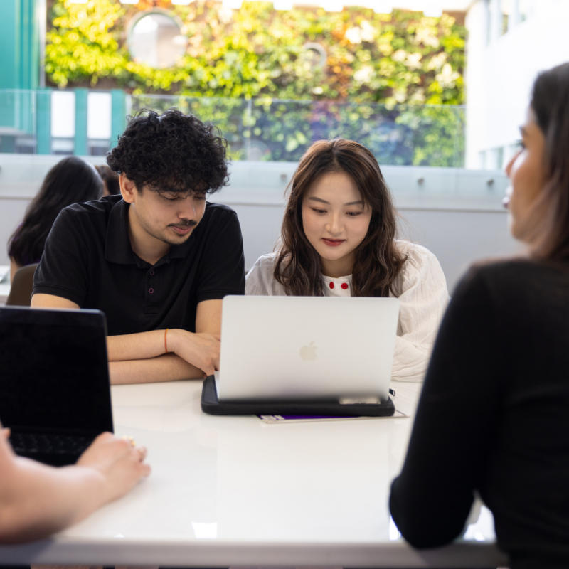 Students working on their laptops in Thames Hall