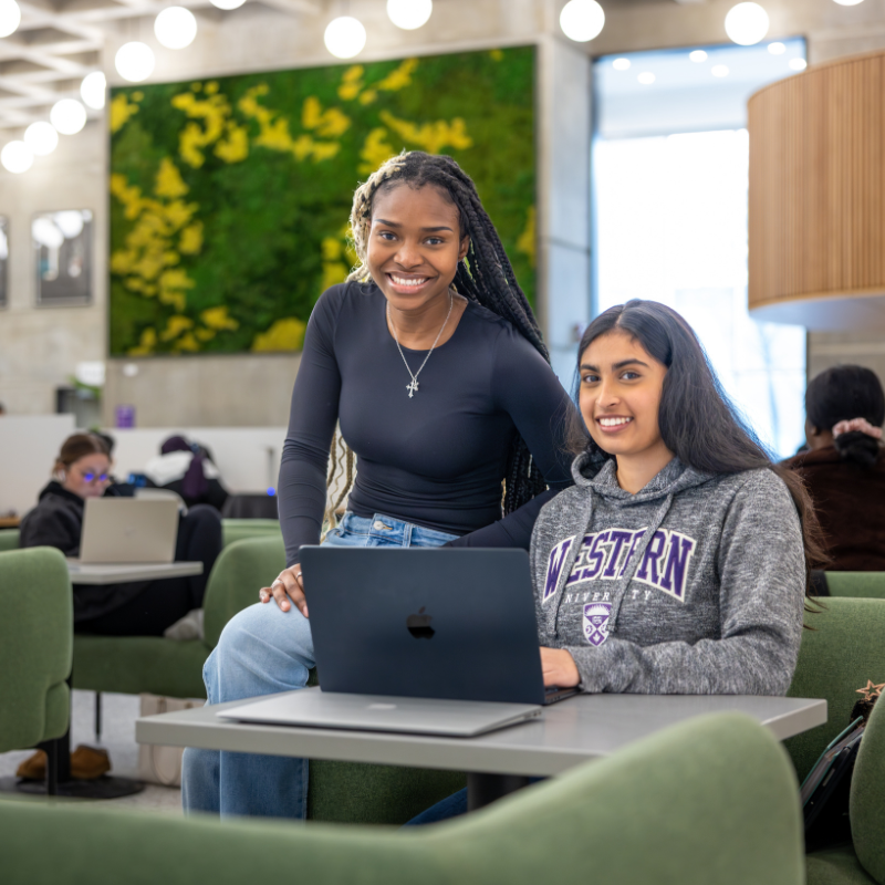 A group of students sitting at a table studying together