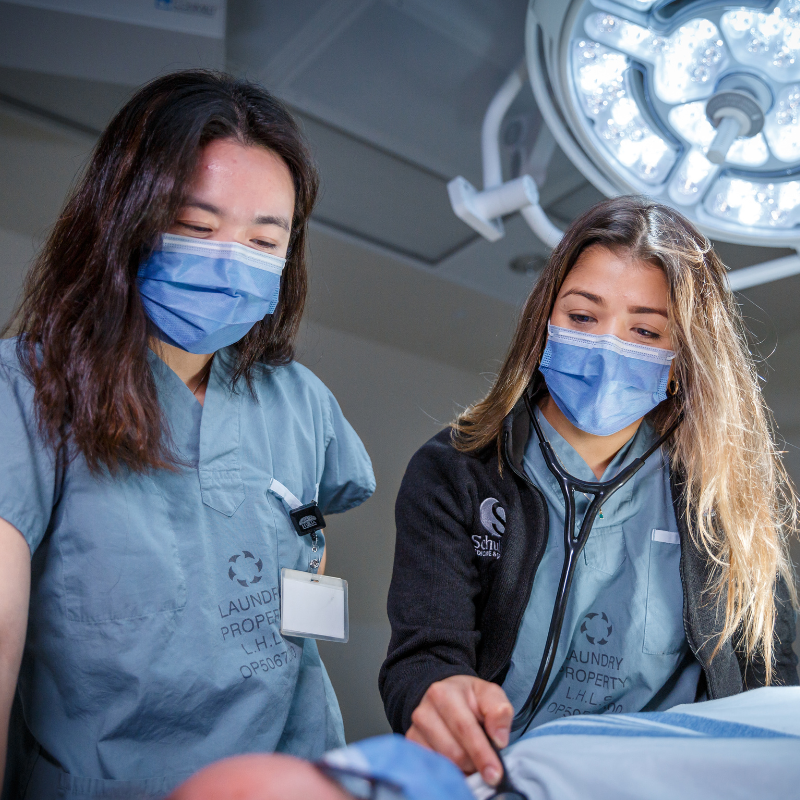 Two medical students in a lab