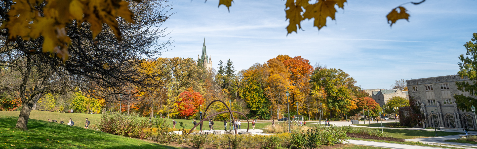 Students walking up University Hill on a fall day