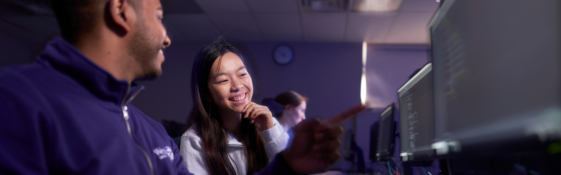 Two students working at a computer