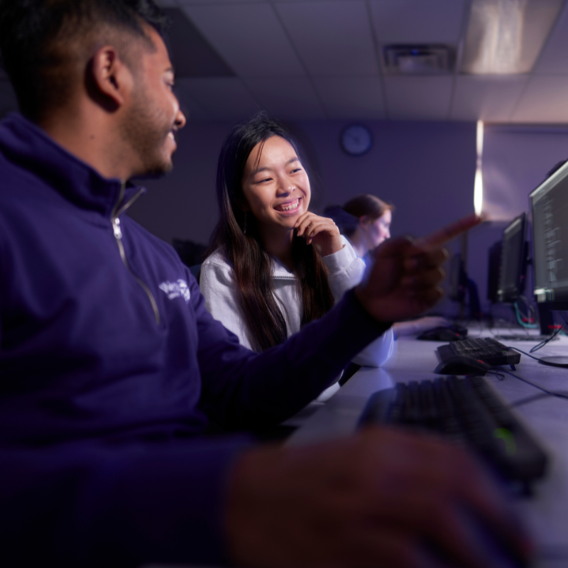 Two students working at a computer