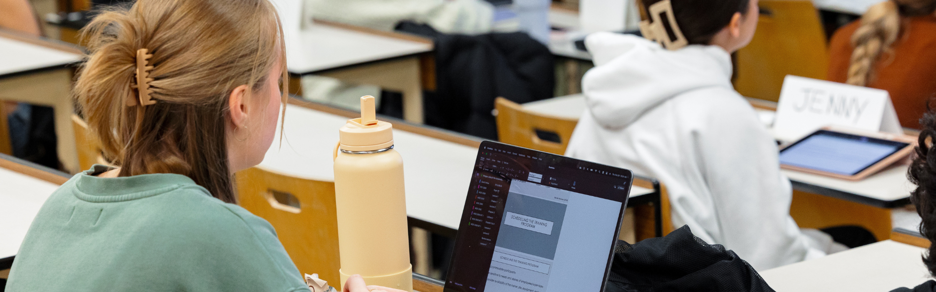 A student sitting in a lecture