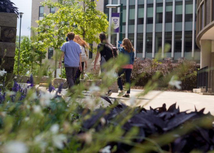 A group of students walking on campus