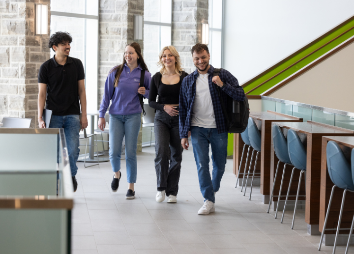 Students walking through the FIMS building