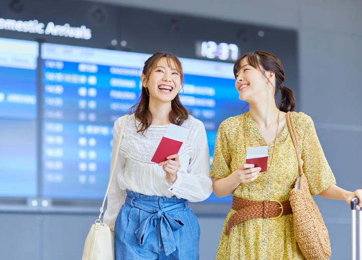 Two female students in an airport