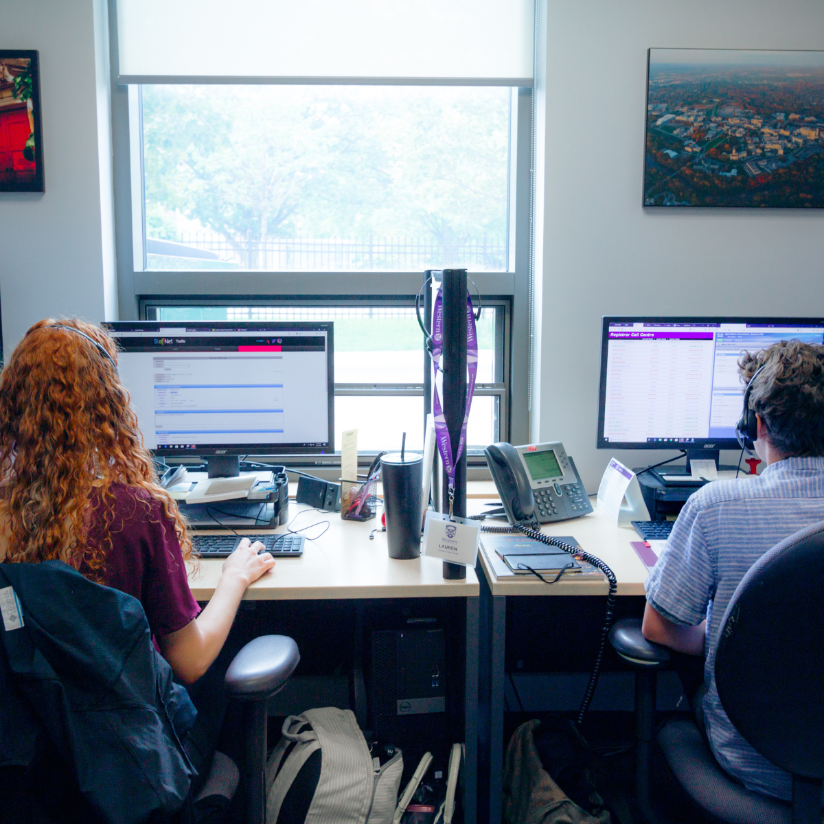 Two student staff working in Student Central